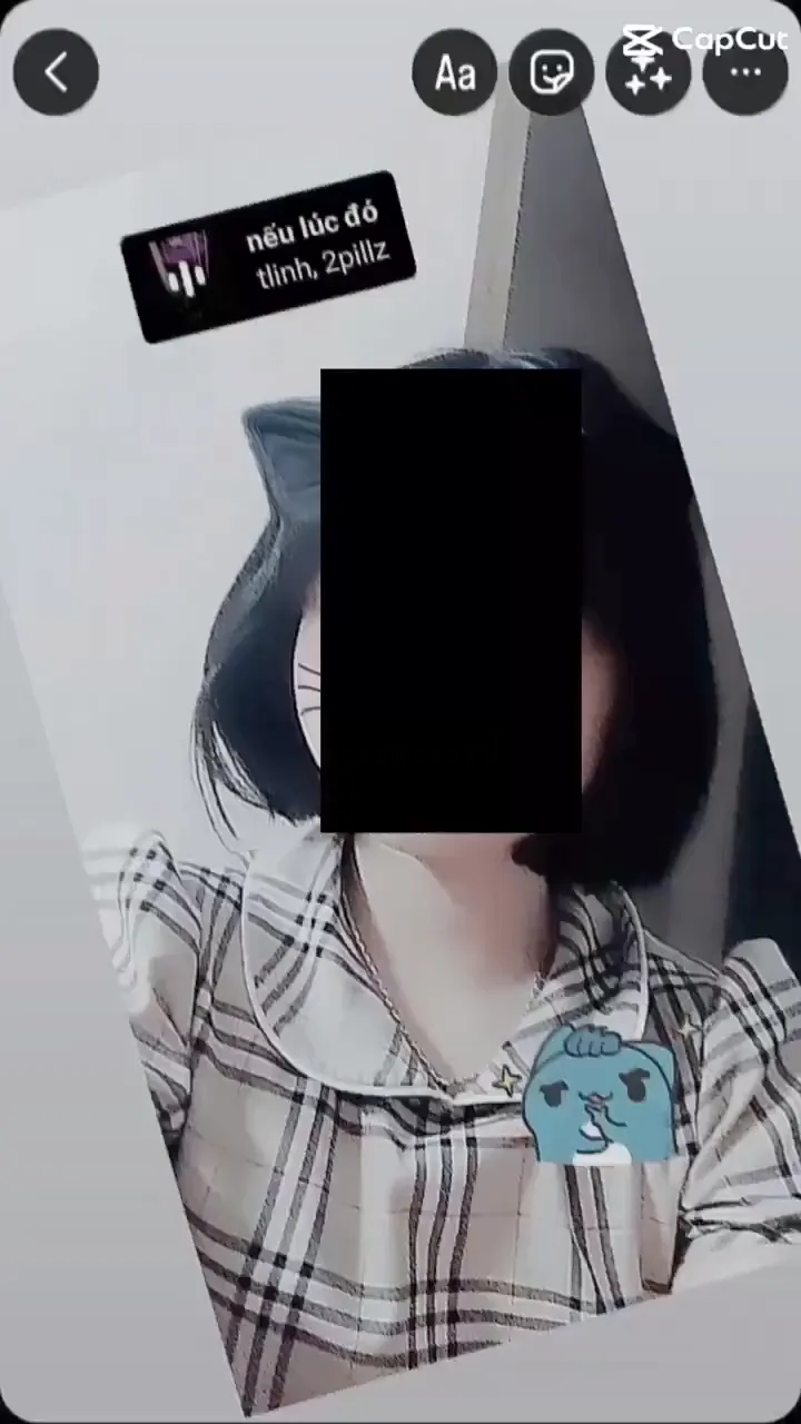 A person posing in a TikTok video with a playful expression
